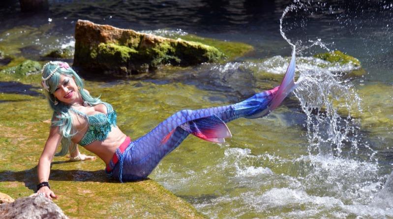 Dressed Up As A Mermaid On Rivers Edge